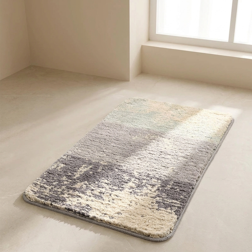Gradient rug on a light wooden floor with a window in the background